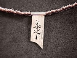 Silver Tree pendant in a glass beads necklace