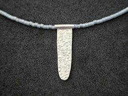 Silver pendant with glass beads