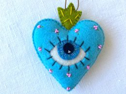 Beautiful the 'All-Seeing Heart' Ornament: A sea-blue heart ornament.