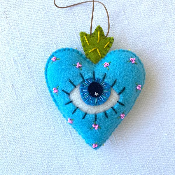 Beautiful the 'All-Seeing Heart' Ornament: A sea-blue heart ornament.