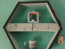 Hexagonal hanging display with pallet block shelf