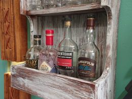 Rustic, repurposed wood, wall-mounted drinks bar with shelf