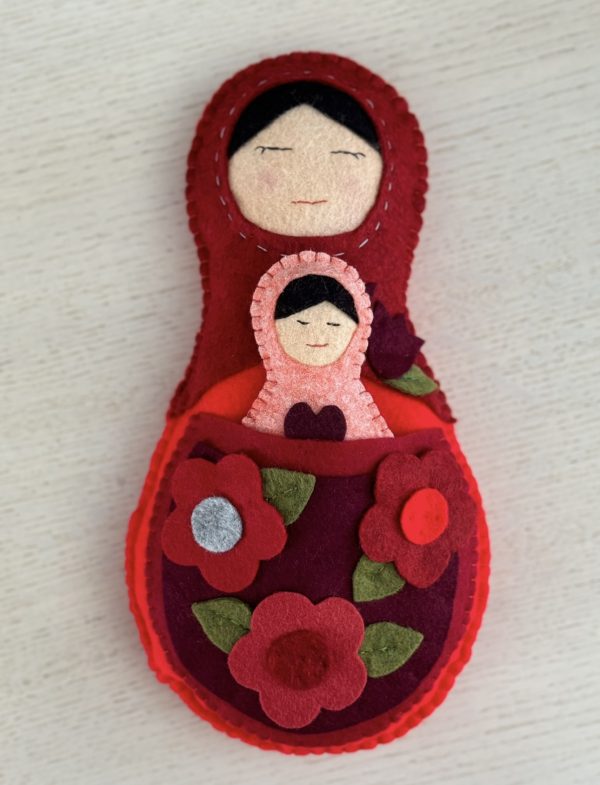Adorable mum and baby felt nesting dolls
