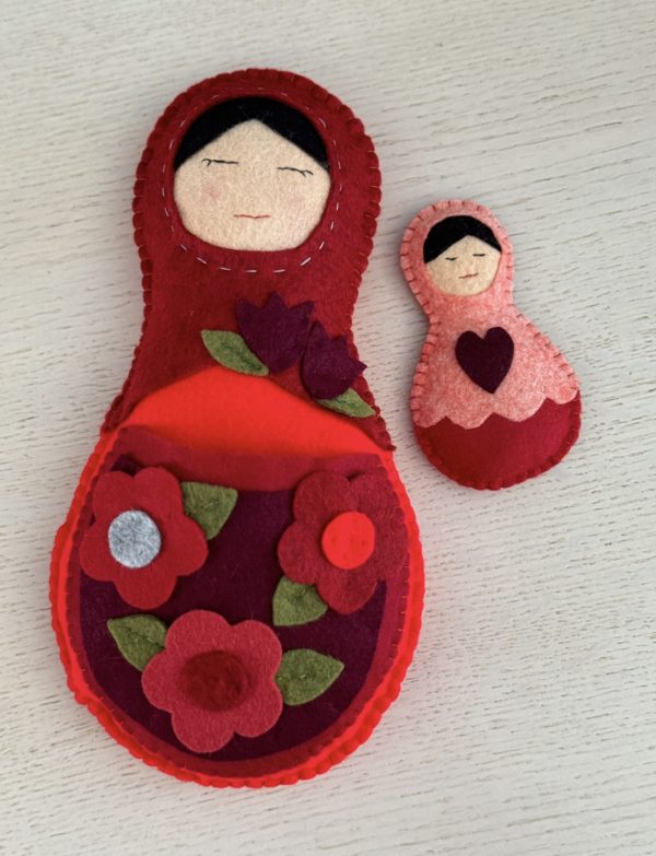 Adorable mum and baby felt nesting dolls