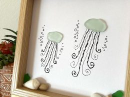 Two happy jellyfish made of seaglass swimming under the sea! Perfect sea inspired unique work!