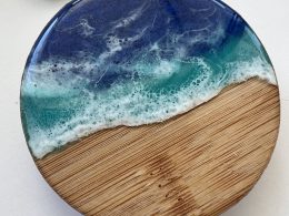 Ocean inspired resin and wood fridge magnet bottle opener.