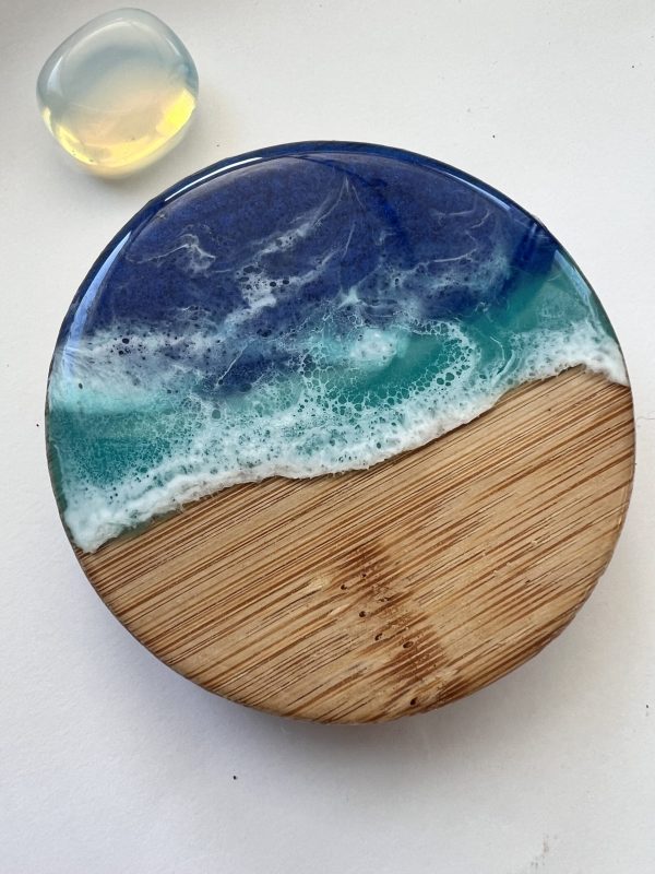 Ocean inspired resin and wood fridge magnet bottle opener.