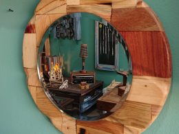 Round, carved, multi wood framed mirror
