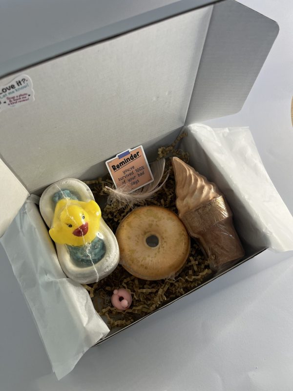Box with three bath bombs