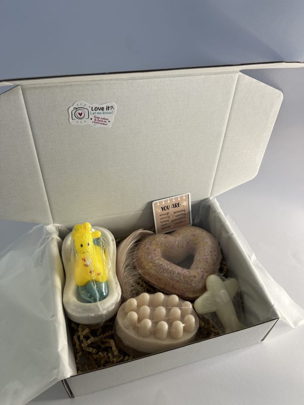 Box with two bath bombs and one massage soap with loofh one soap for kids